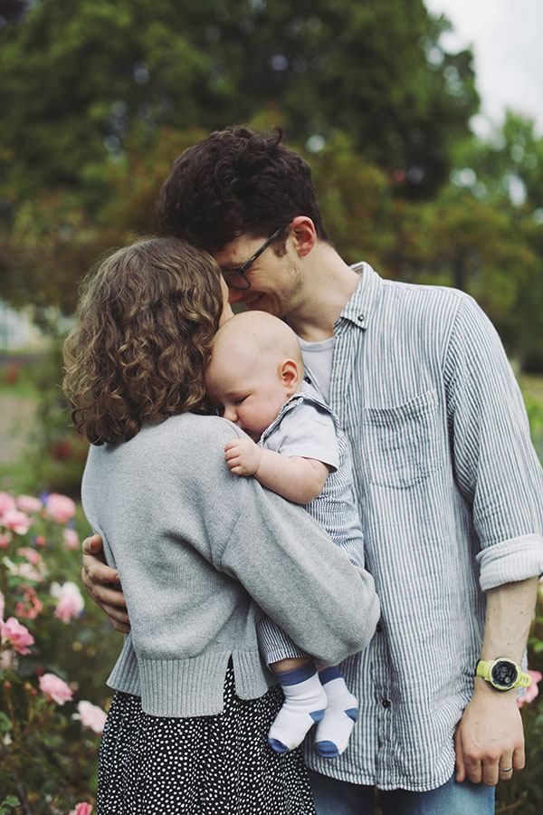 Parents playing with their baby during a summer photoshoot in Sheffield