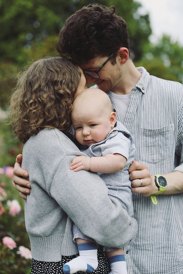 Parents playing with their baby during a summer photoshoot in Sheffield