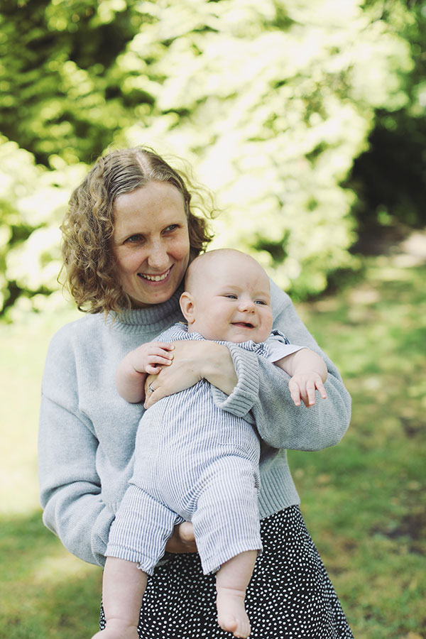 Parents playing with their baby during a summer photoshoot in Sheffield