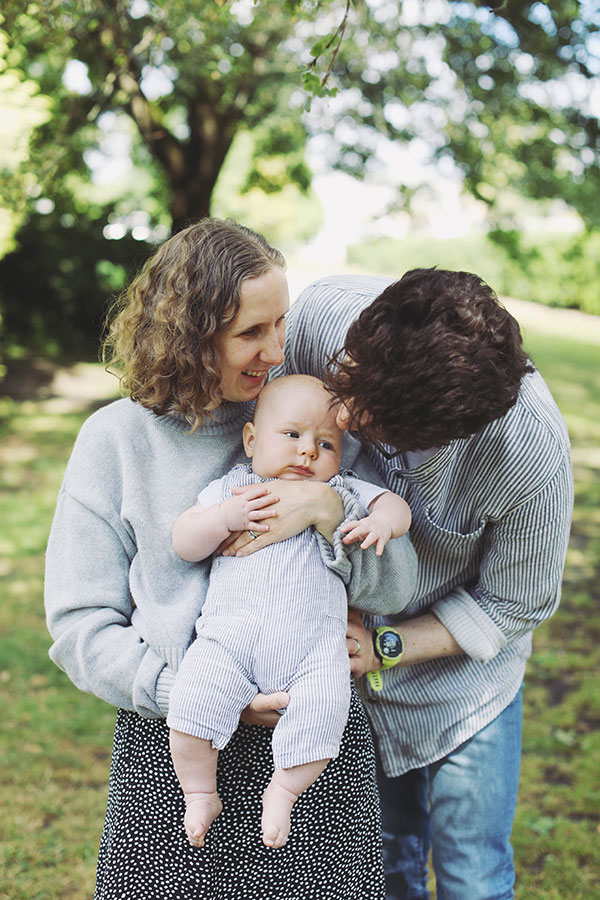 Parents playing with their baby during a summer photoshoot in Sheffield