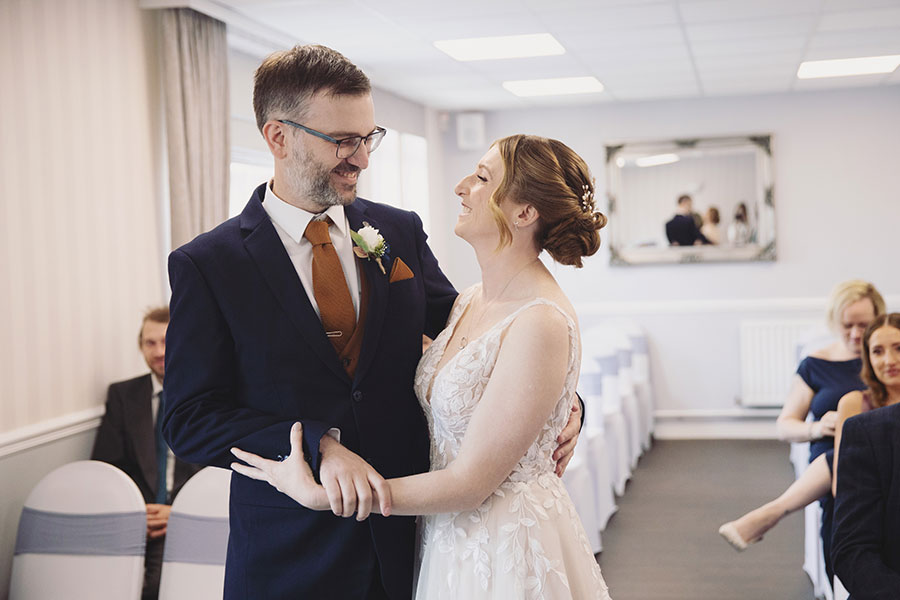 Documentary-style Stamford Registry Office wedding photography of happy couple