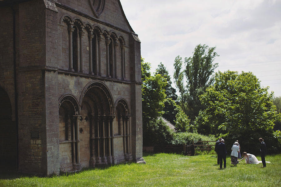 Stamford Registry Office wedding photography of couple walking hand in hand in sunshine