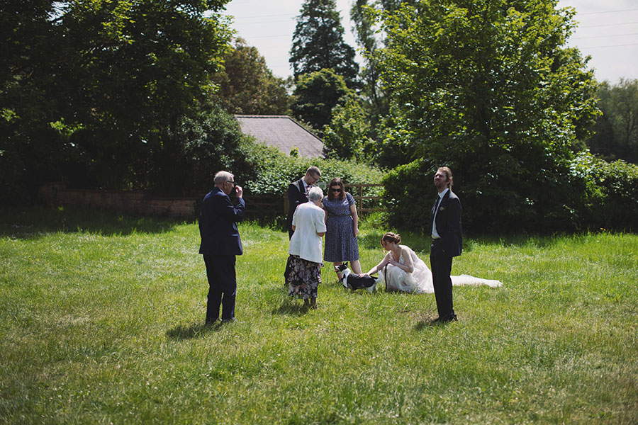Stamford Registry Office wedding photography of couple walking hand in hand in sunshine