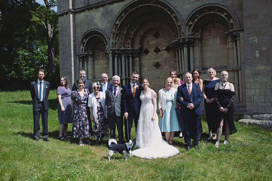 Stamford Registry Office wedding photography of couple walking hand in hand in sunshine