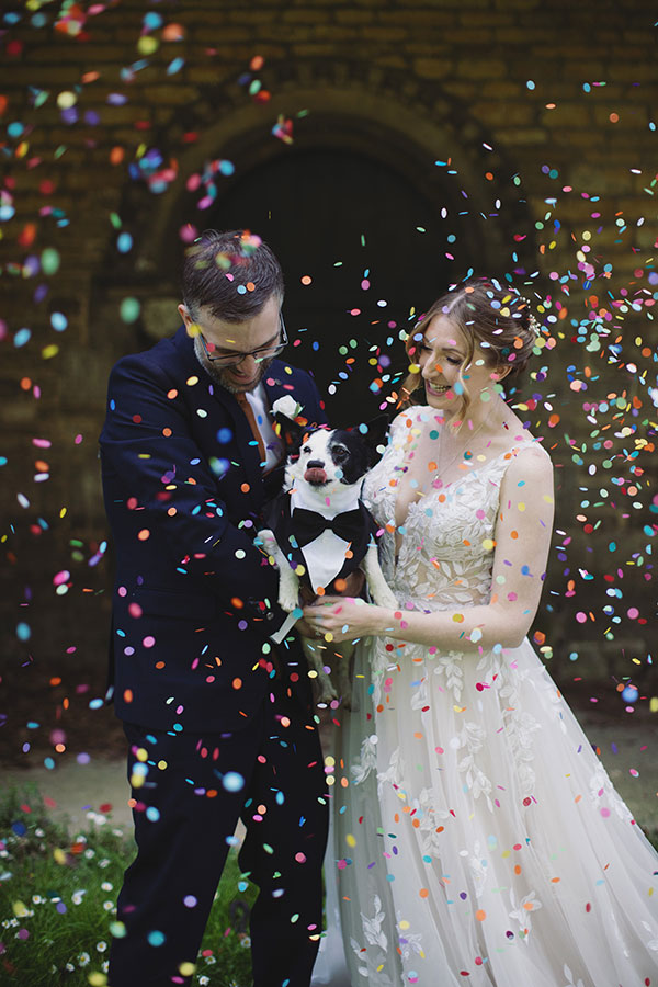 Stamford Registry Office wedding photography of couple walking hand in hand in sunshine