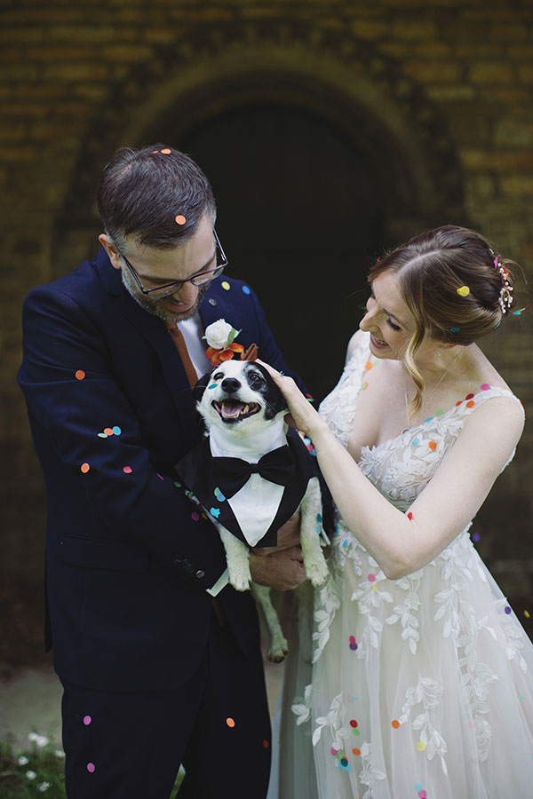 Groom smiling at bride during sunny Stamford Registry Office wedding ceremony