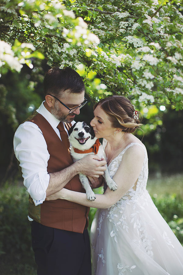 Groom smiling at bride during sunny Stamford Registry Office wedding ceremony