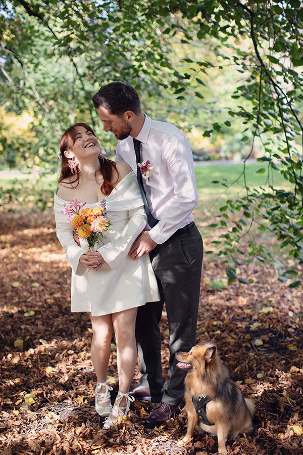 Relaxed Manchester wedding photography portrait of the couple with their dog Pedro after the ceremony