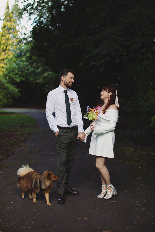Manchester wedding photography capturing Rebecca and Tom with friends in the gardens