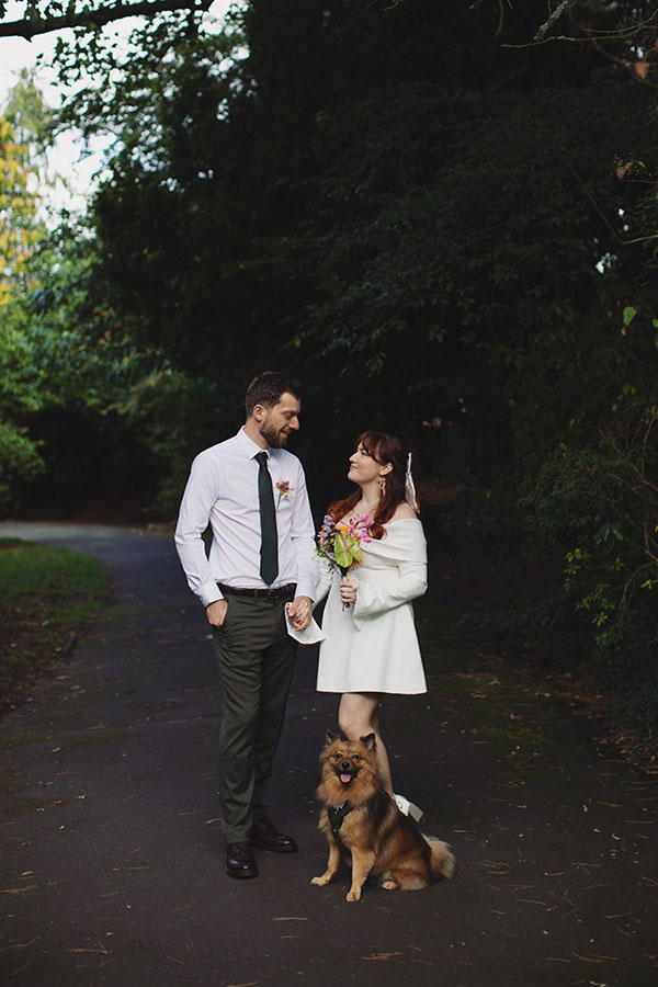 Manchester wedding photography capturing Rebecca and Tom with friends in the gardens