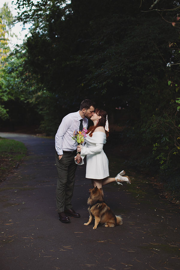 Manchester wedding photography capturing Rebecca and Tom with friends in the gardens