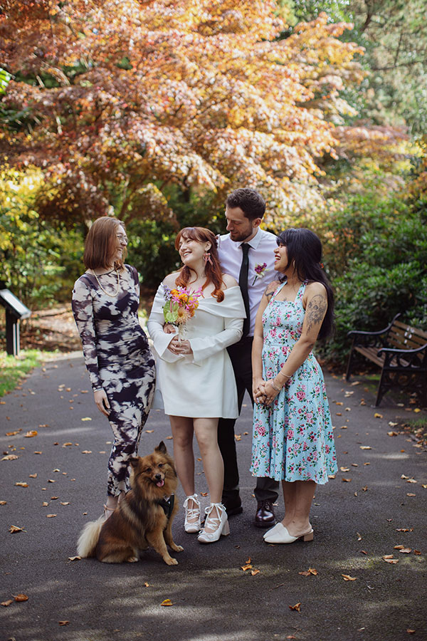 Manchester wedding photography capturing Rebecca and Tom celebrating with friends after their ceremony