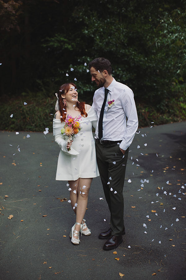 Manchester wedding photography capturing Rebecca and Tom with friends in the gardens