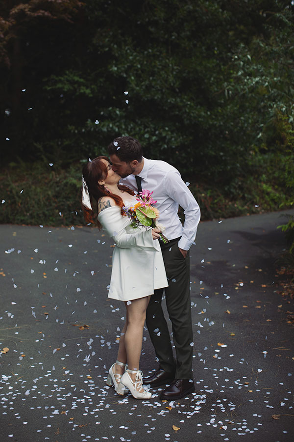 Manchester wedding photography capturing Rebecca and Tom celebrating with friends after their ceremony