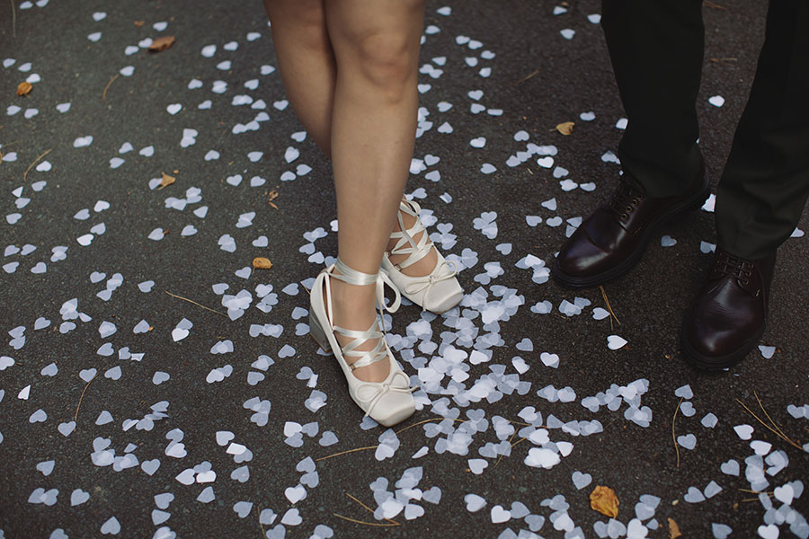 Confetti moment with a pet dog and Rebecca and Tom just married in Manchester