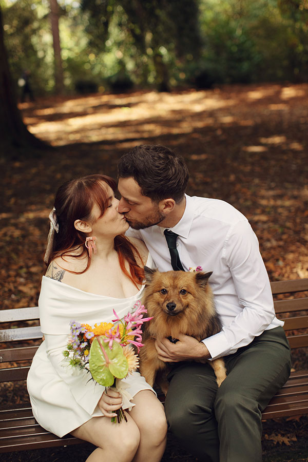 Manchester wedding photography of Rebecca and Tom with their dog Pedro in the gardens
