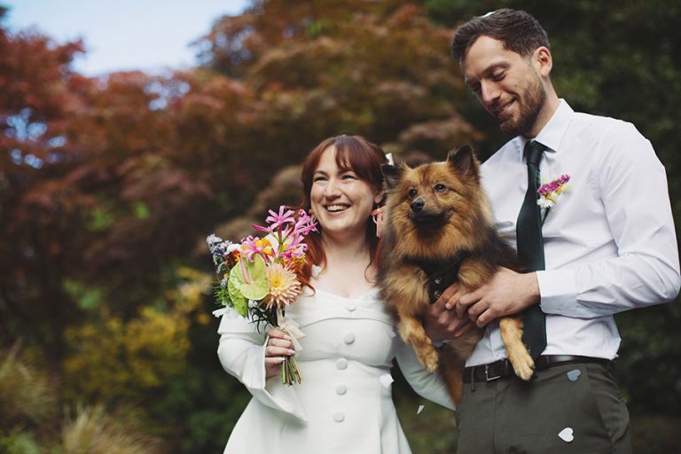 Confetti moment with a pet dog and Rebecca and Tom with their Manchester elopement wedding photography