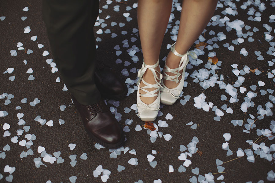Confetti moment with a pet dog and Rebecca and Tom just married in Manchester