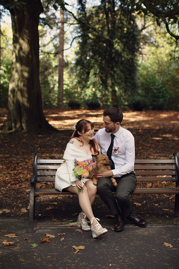 Manchester wedding photography of Rebecca and Tom with their dog Pedro in the gardens