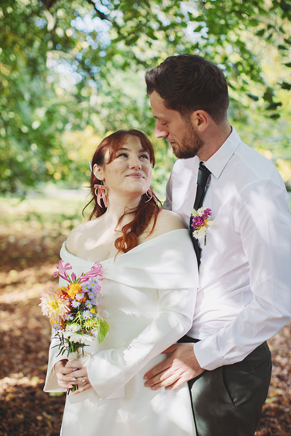 Manchester wedding photography of Rebecca and Tom with their dog Pedro in the gardens