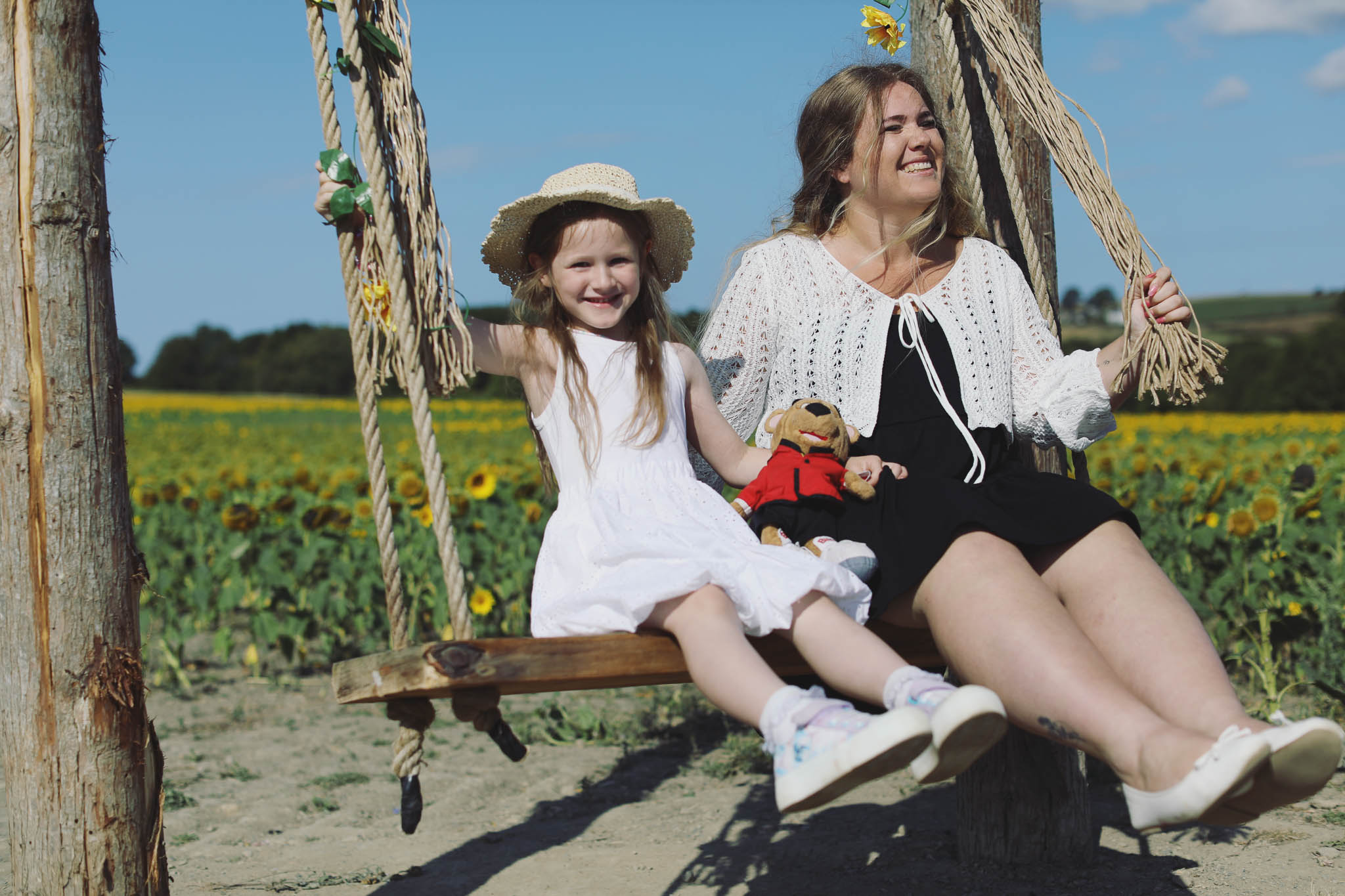 Portrait photography at Barlow Sunflower Fields with rows of bright yellow flowers