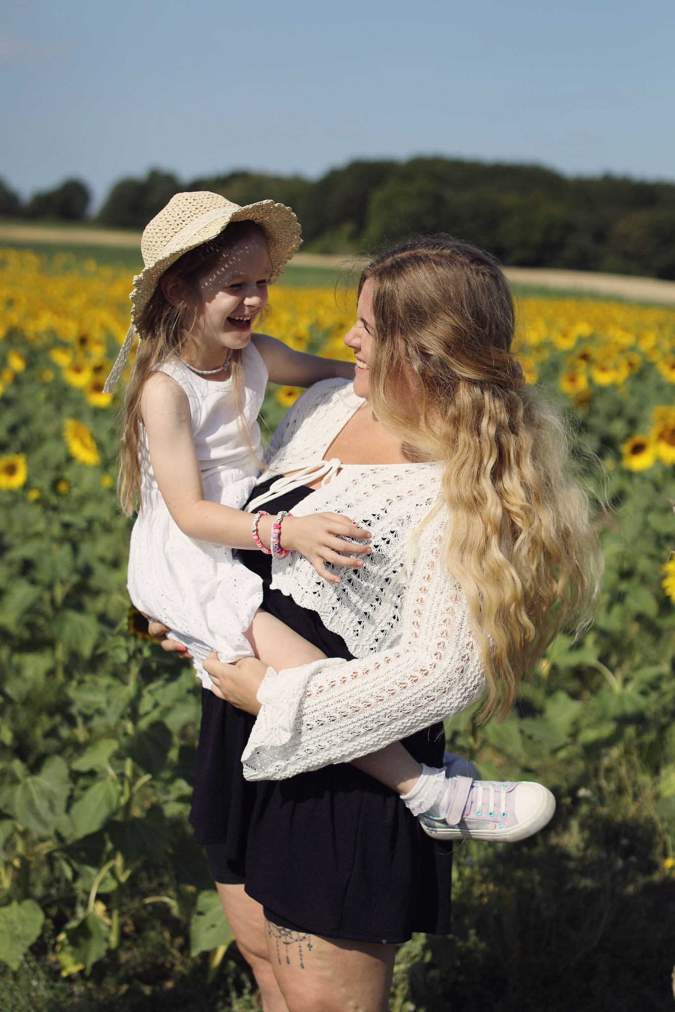 Portrait photography at Barlow Sunflower Fields with rows of bright yellow flowers