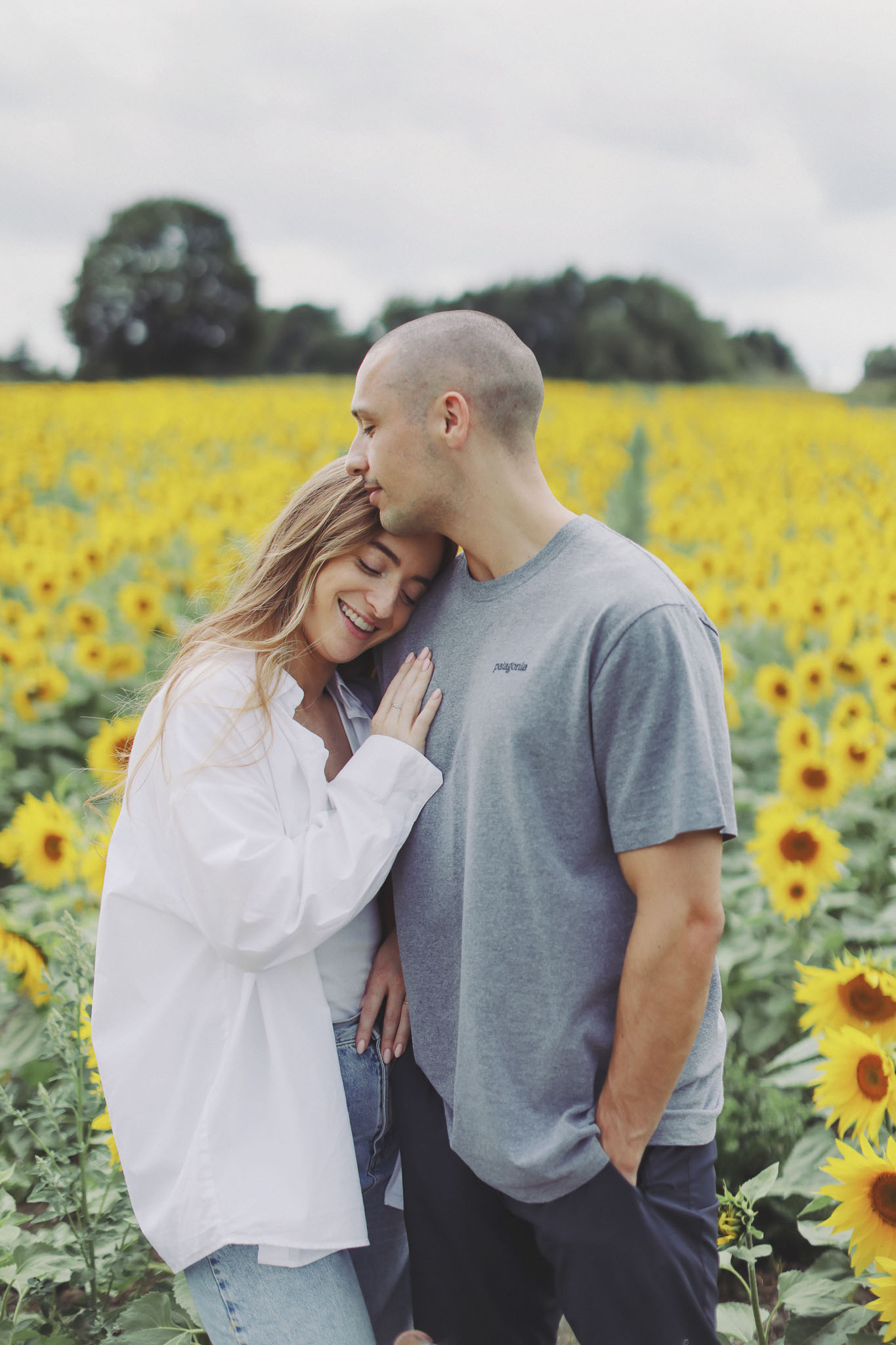 Portrait photography at Barlow Sunflower Fields with rows of bright yellow flowers