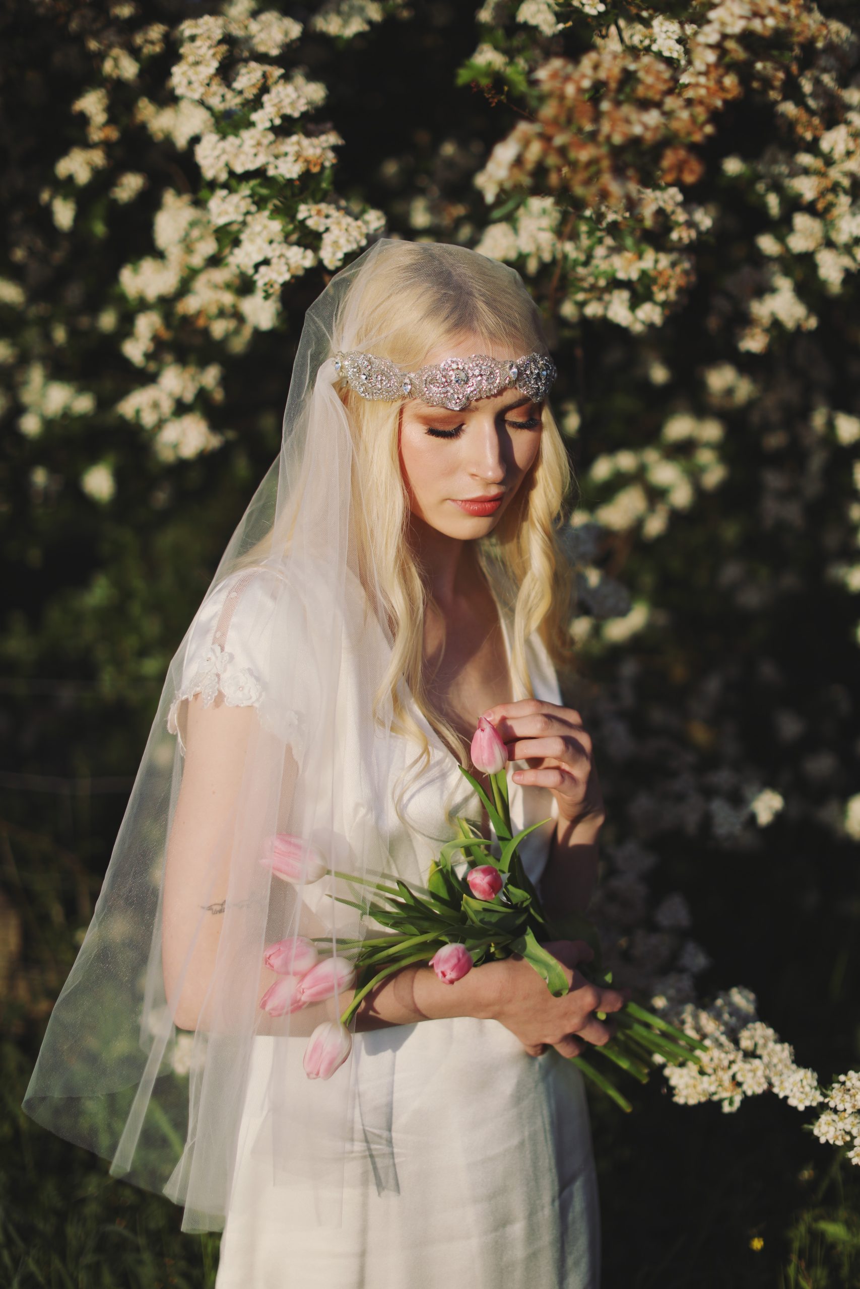 Soft and ethereal bridal portrait with delicate lace details and glowing natural light