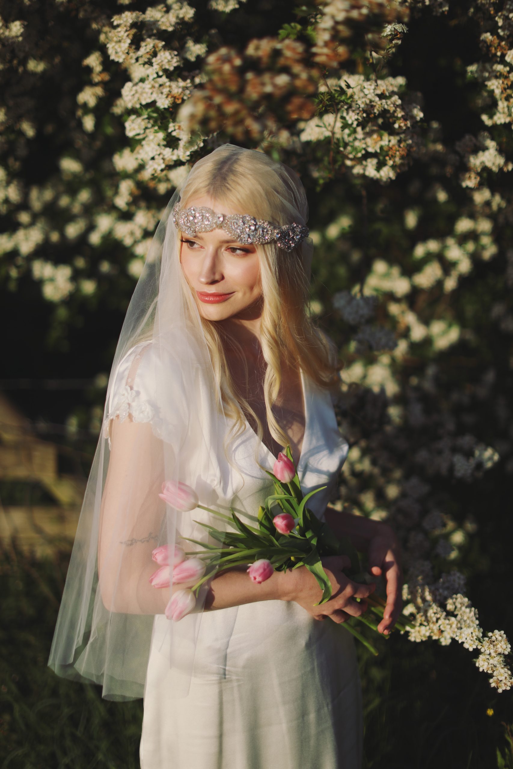 Soft and ethereal bridal portrait with delicate lace details and glowing natural light