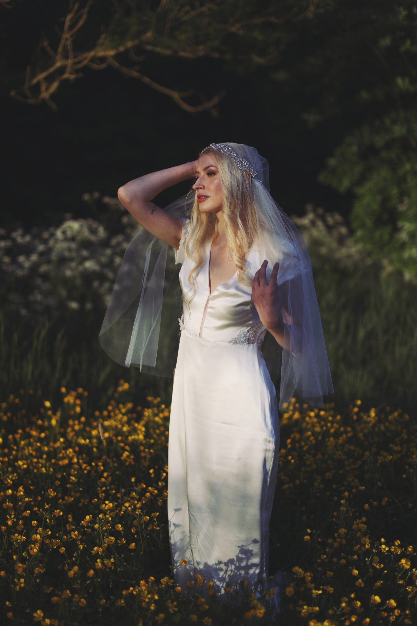 Whimsical bridal editorial featuring a modern romantic bride in a blooming garden
