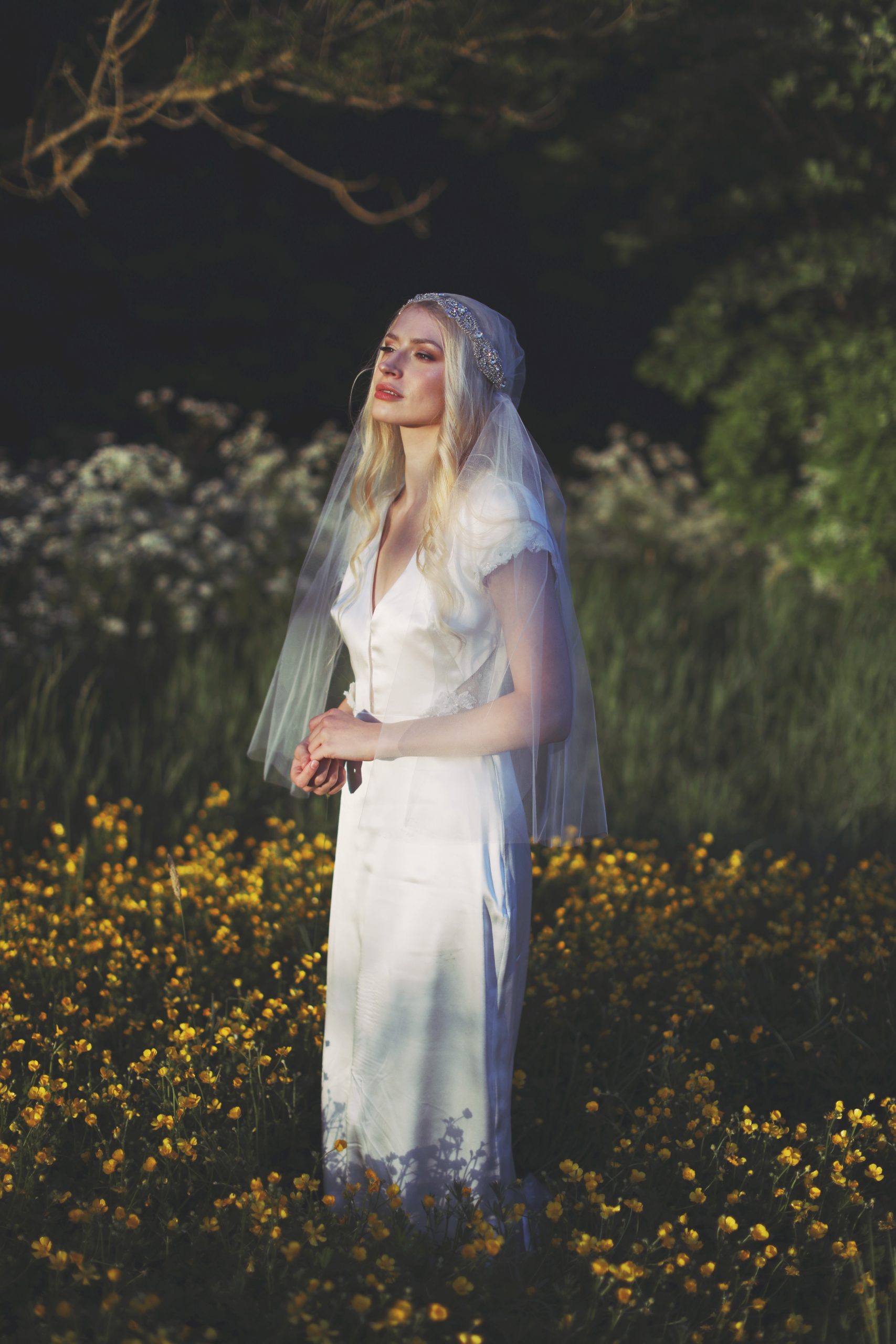 Whimsical bridal editorial featuring a modern romantic bride in a blooming garden