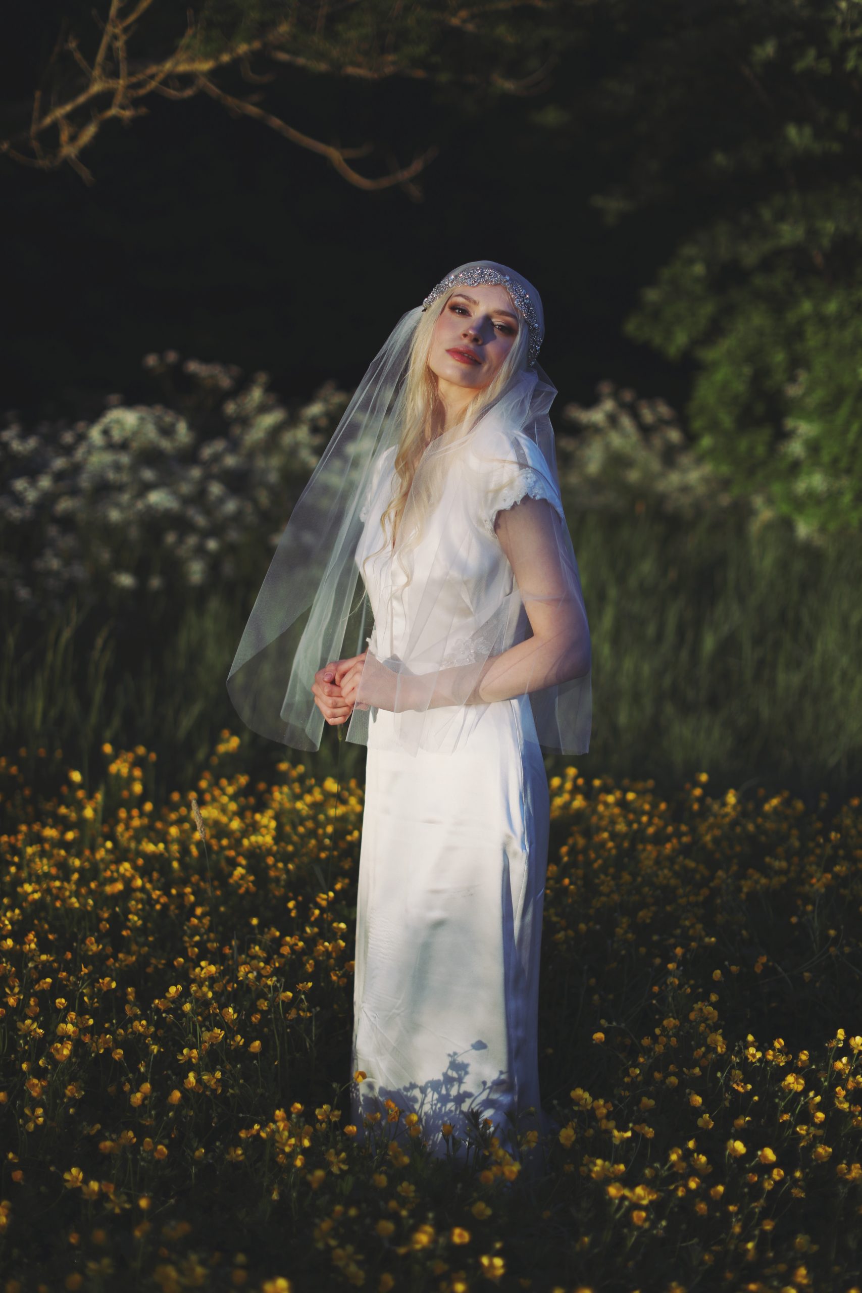 Whimsical bridal editorial featuring a modern romantic bride in a blooming garden