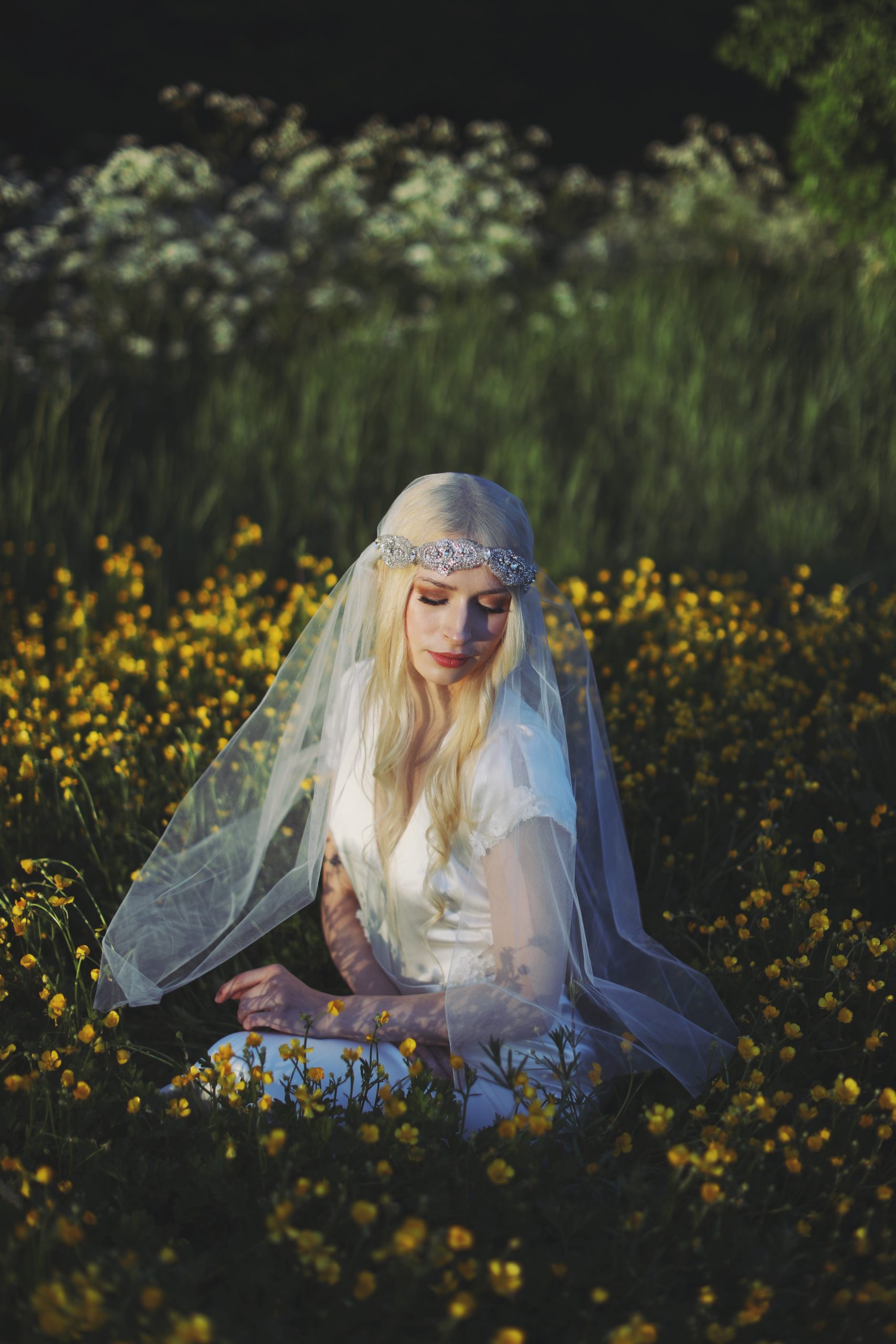Whimsical bridal editorial featuring a modern romantic bride in a blooming garden
