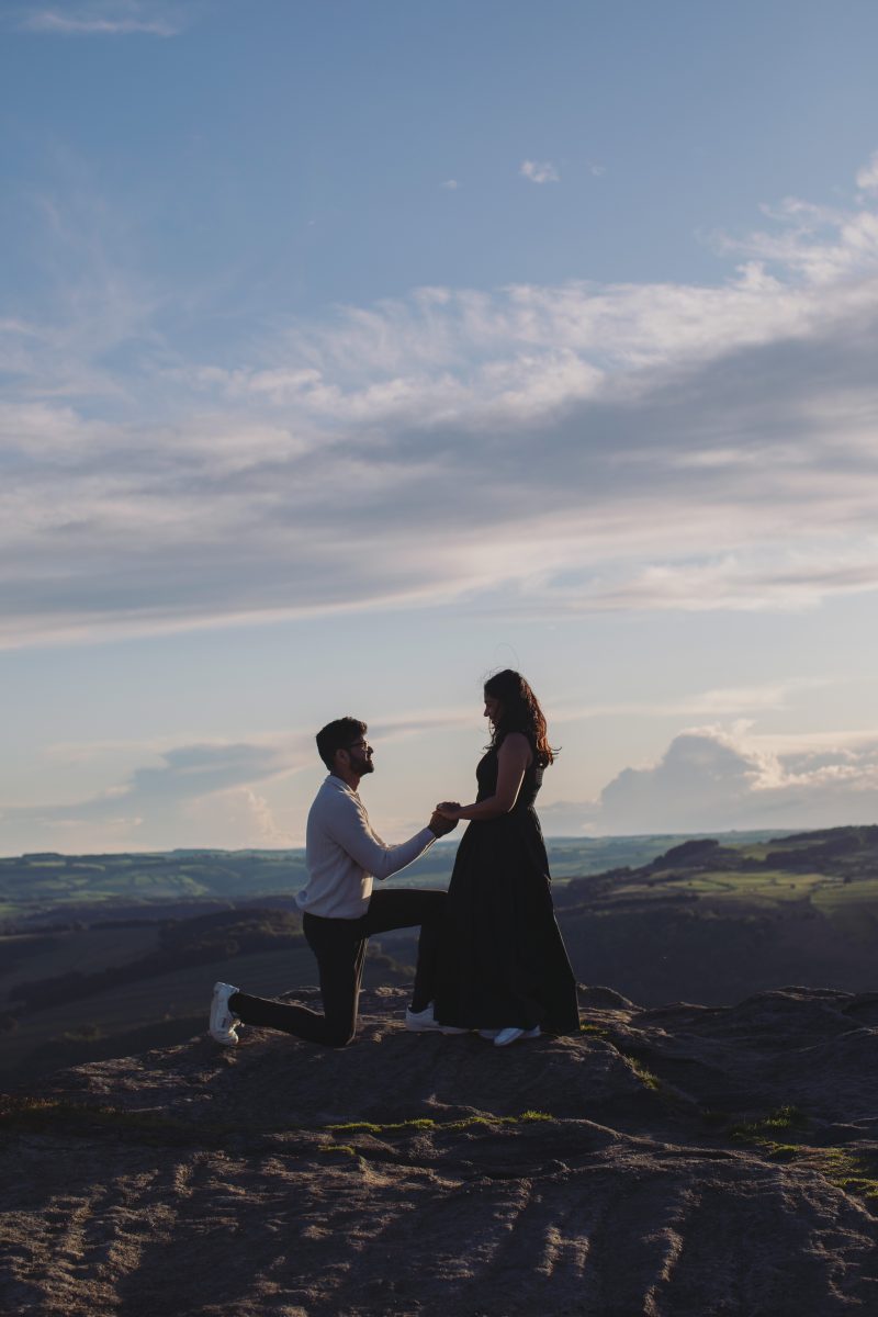 Surprise proposal overlooking the Peak District at Curbar Edge