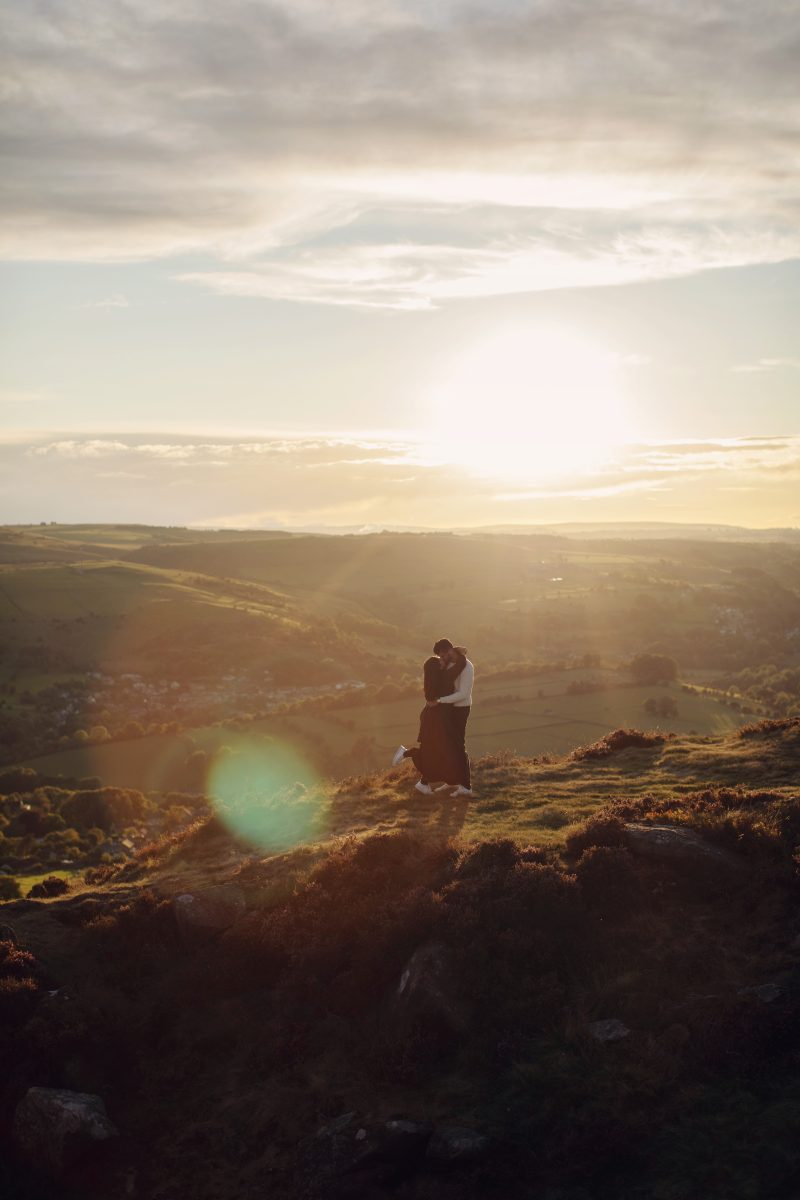 Rahul proposing to Rhea at Curbar Edge in the Peak District.