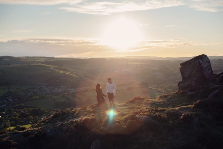 Peak District Proposal Photographer ♡ Rahul & Rhea’s Surprise Proposal at Curbar Edge 1 Rahul proposing to Rhea at Curbar Edge in the Peak District.