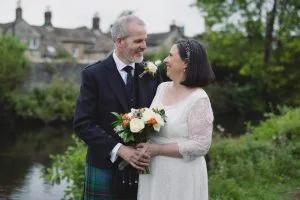 Siobhan and Jonathan walking through Bakewell following their registry office wedding.