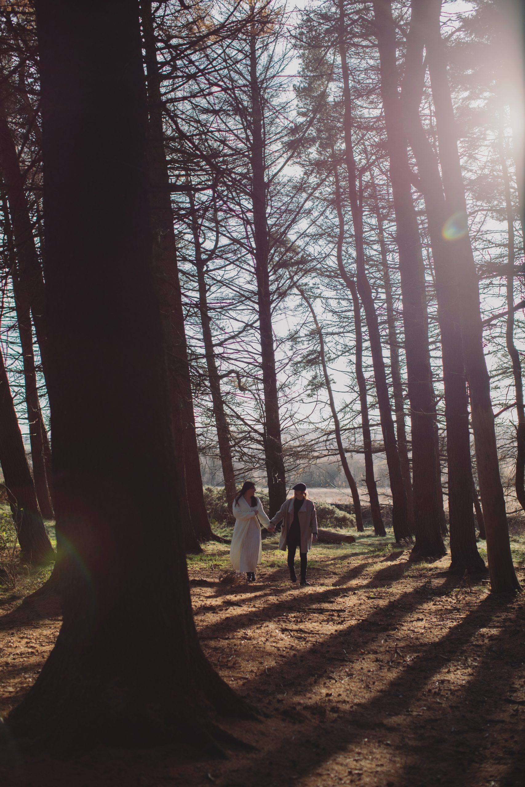 Cat & Liam ♡ Engagement Photoshoot at Shillito Woods 4 Cat and Liam walking hand in hand through Shillito Woods during their autumn engagement photoshoot in the Peak District.
