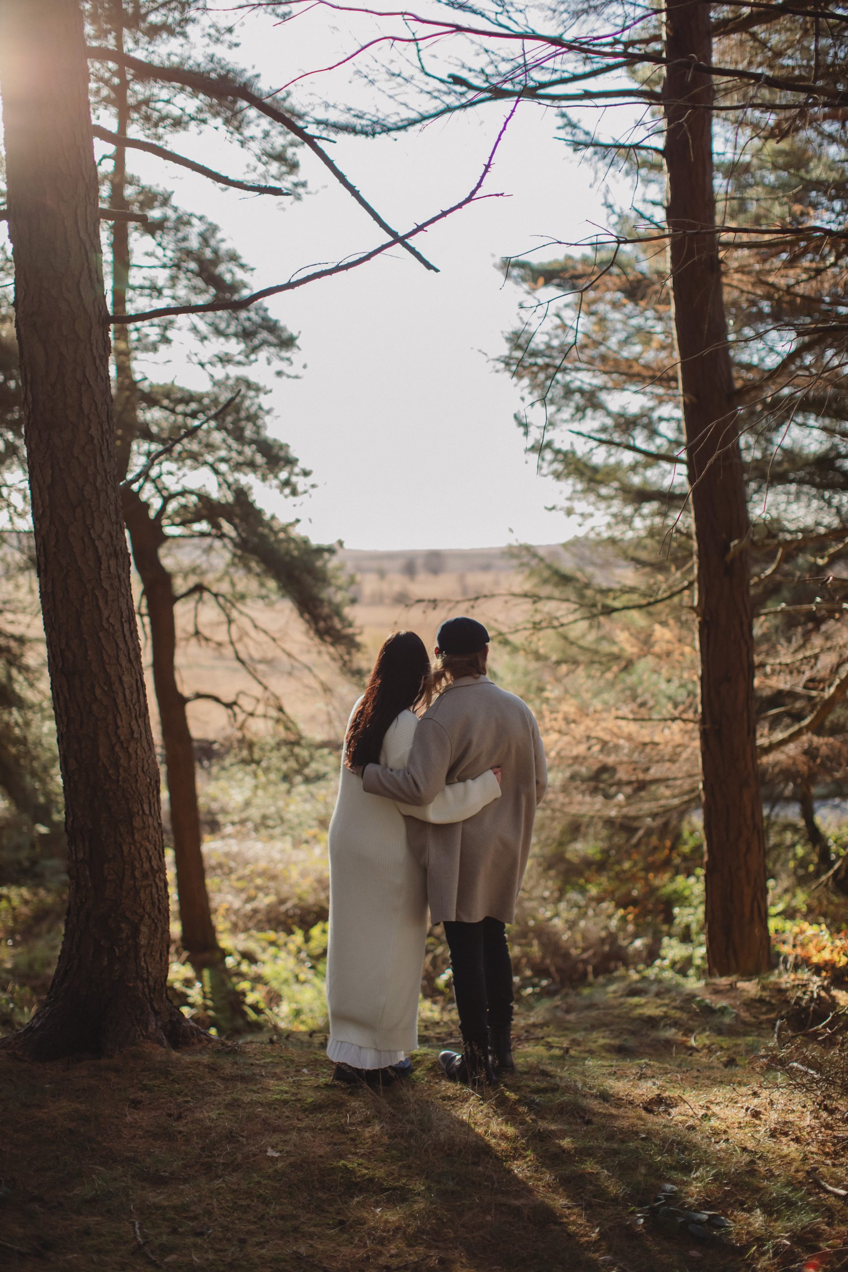 Cat & Liam ♡ Engagement Photoshoot at Shillito Woods 10 Engaged couple Cat and Liam standing among golden autumn leaves in Shillito Woods near Sheffield.