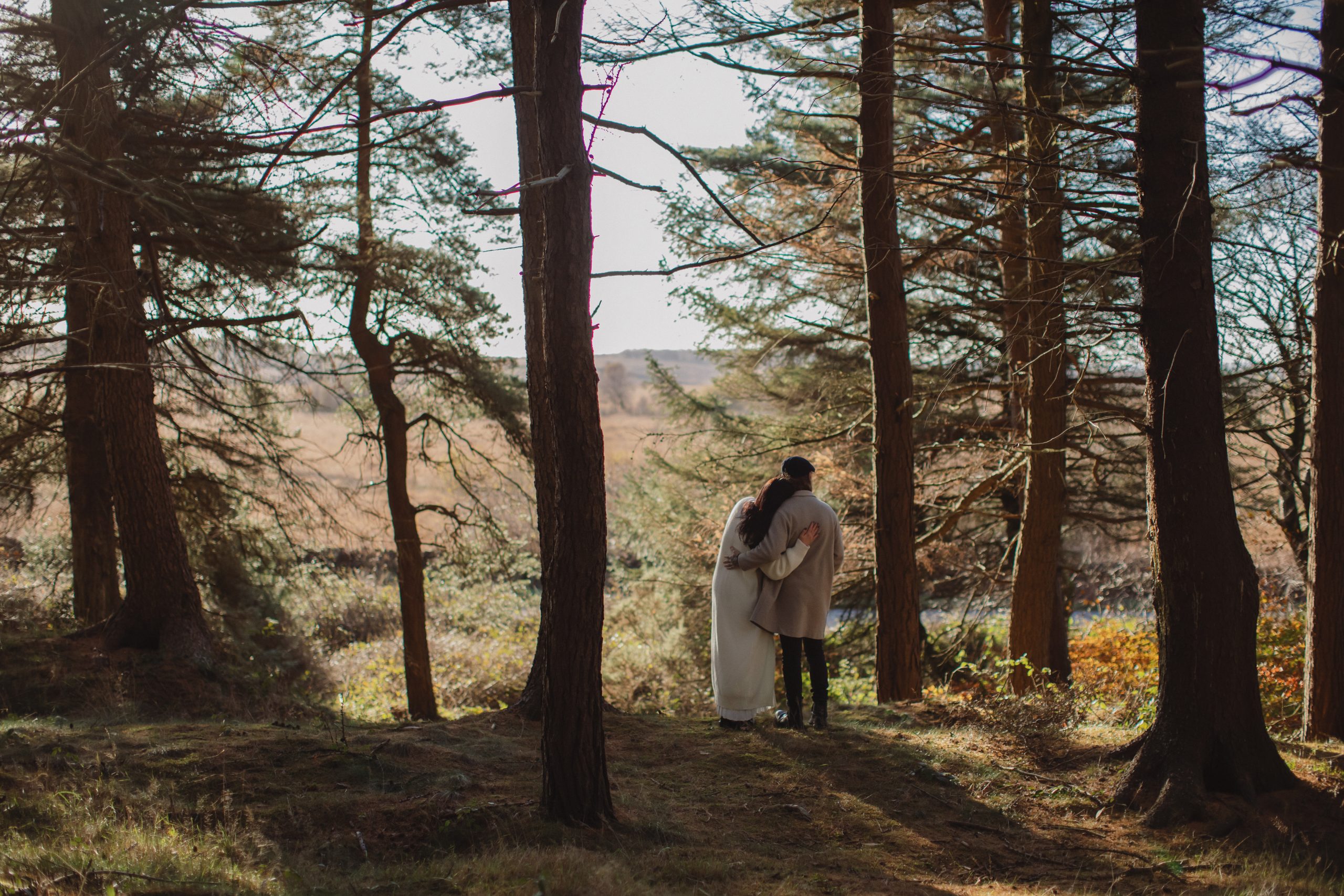 Cat & Liam ♡ Engagement Photoshoot at Shillito Woods 6 Engaged couple Cat and Liam standing among golden autumn leaves in Shillito Woods near Sheffield.