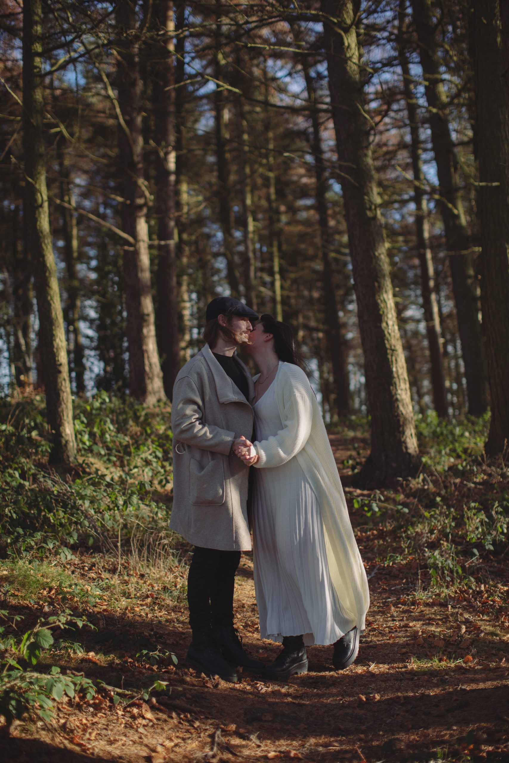 Cat & Liam ♡ Engagement Photoshoot at Shillito Woods 8 Engaged couple Cat and Liam standing among golden autumn leaves in Shillito Woods near Sheffield.