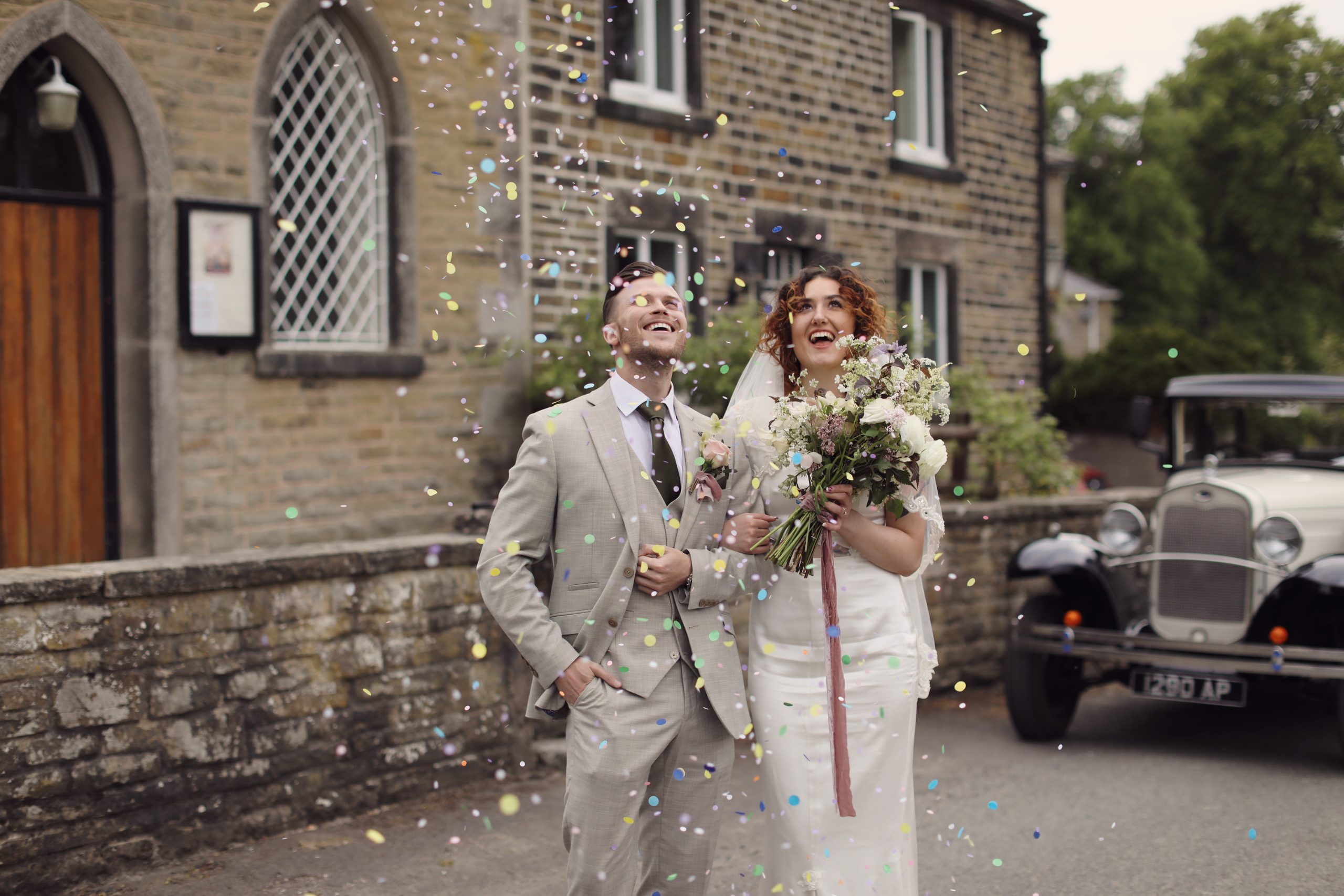 Bride wearing a Kate Clare Couture wedding dress with a New York Bride veil.