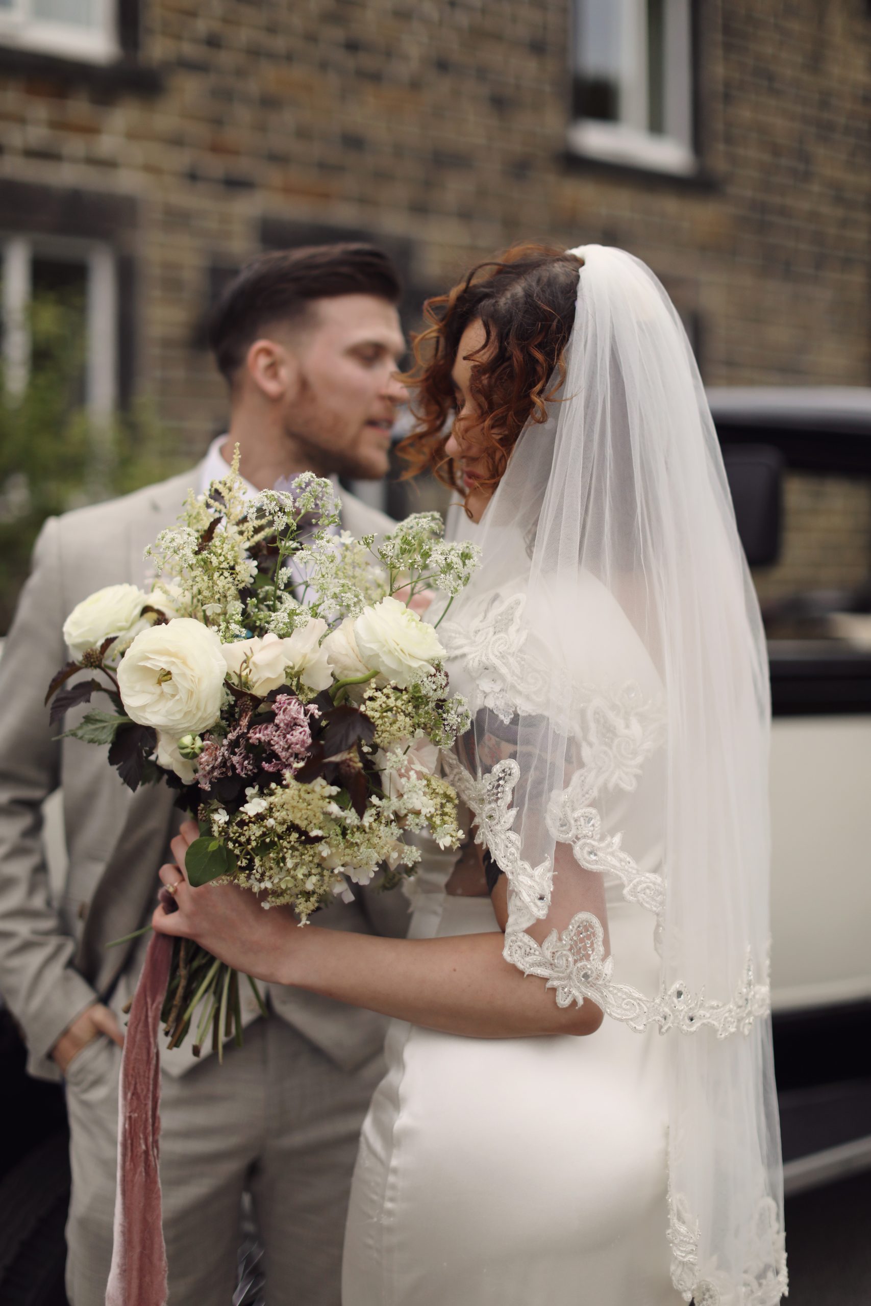 Editorial wedding portraits with a classic vintage car.
