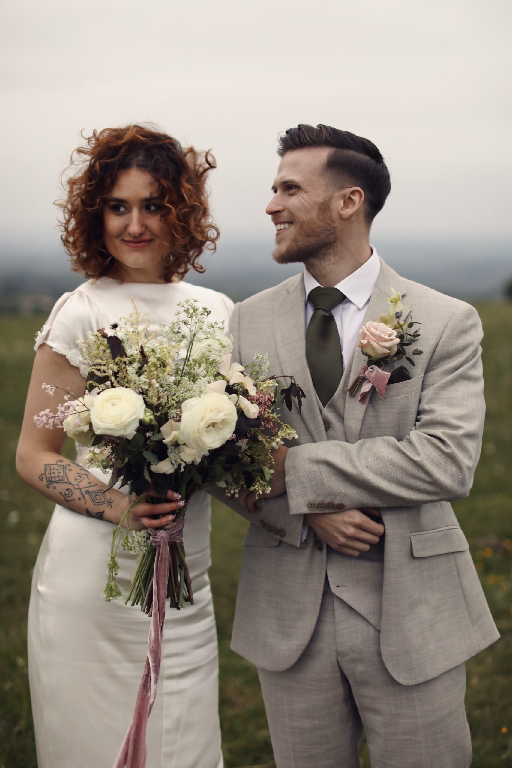 Elegant bridal portrait in a minimalist satin wedding dress.